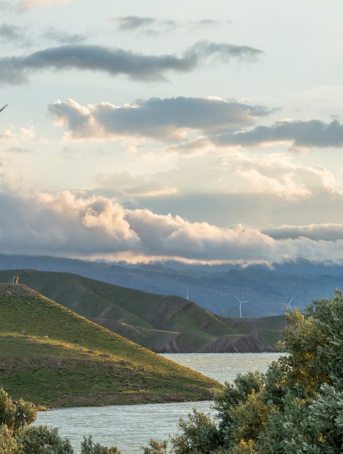 wind-power-turbine-hill-front-cloudy-sky wind-power-turbine-hill-front-cloudy-sky