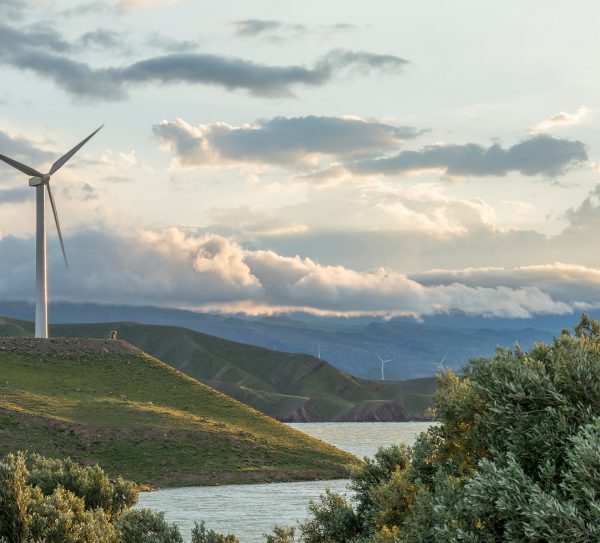 wind-power-turbine-hill-front-cloudy-sky wind-power-turbine-hill-front-cloudy-sky